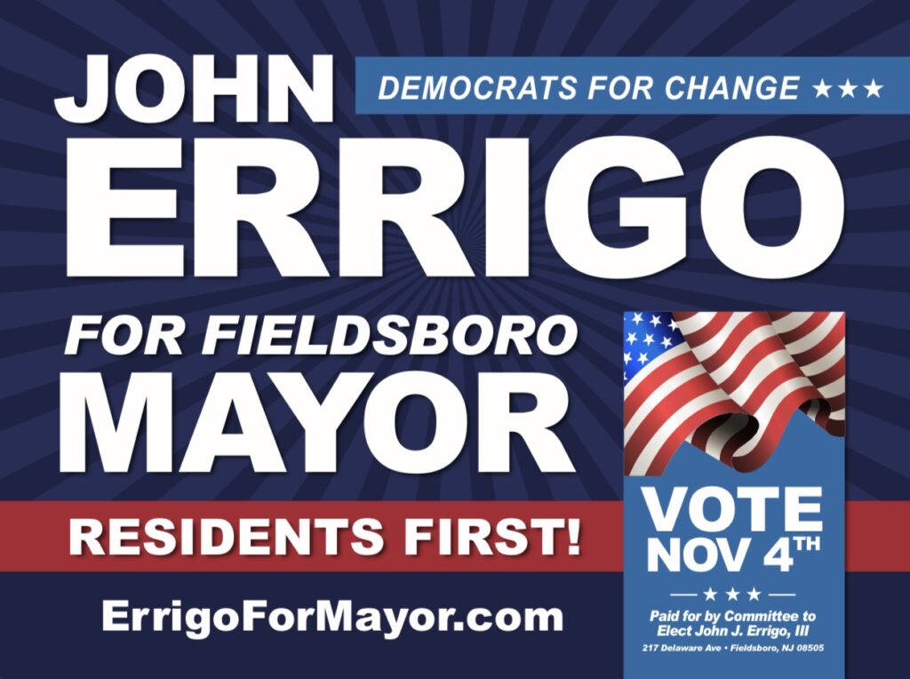 Nov campaign sign with picture of an American flag and with the text, John Errigo for Fieldsboro Mayor, Residents First, Vote Nov 4th Paid for by Committee to Elect John J. Errigo, III